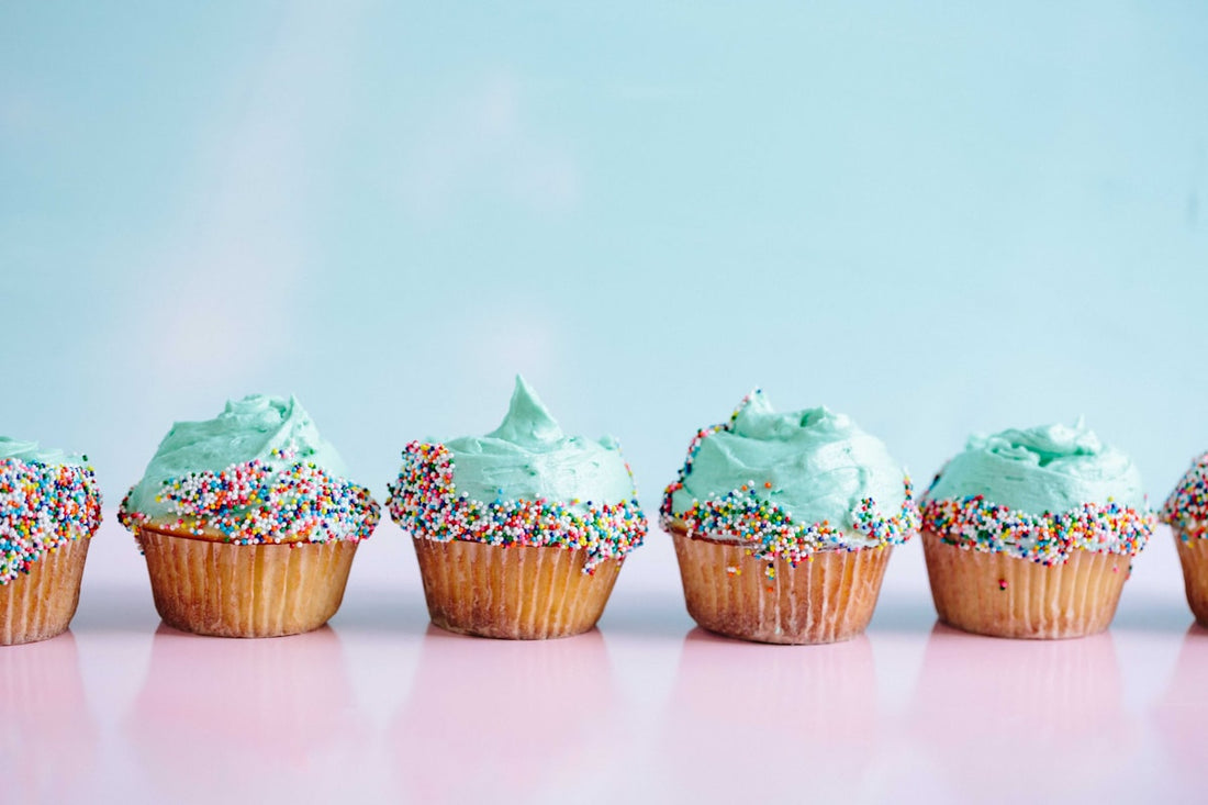 Colorful cupcakes with two-tone swirled ombre frosting