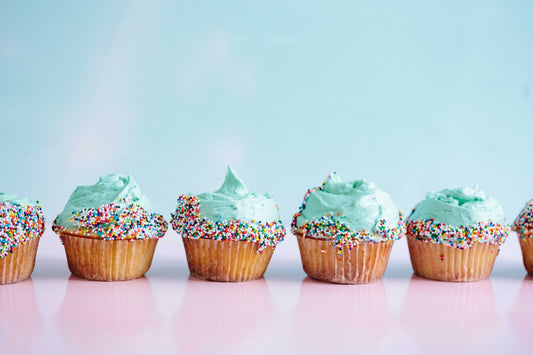 Colorful cupcakes with two-tone swirled ombre frosting