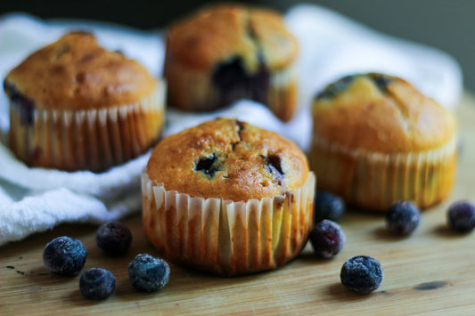 Beautiful blueberry muffins on rustic wooden table