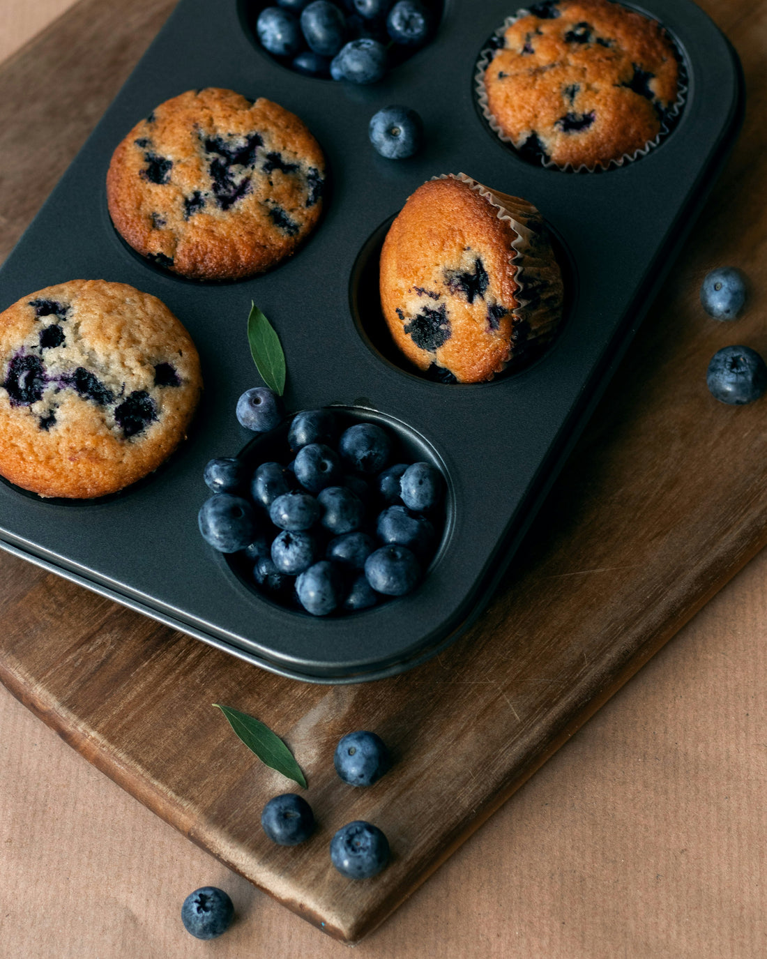 Multiple mini blueberry muffins in baking tin - batch of 24
