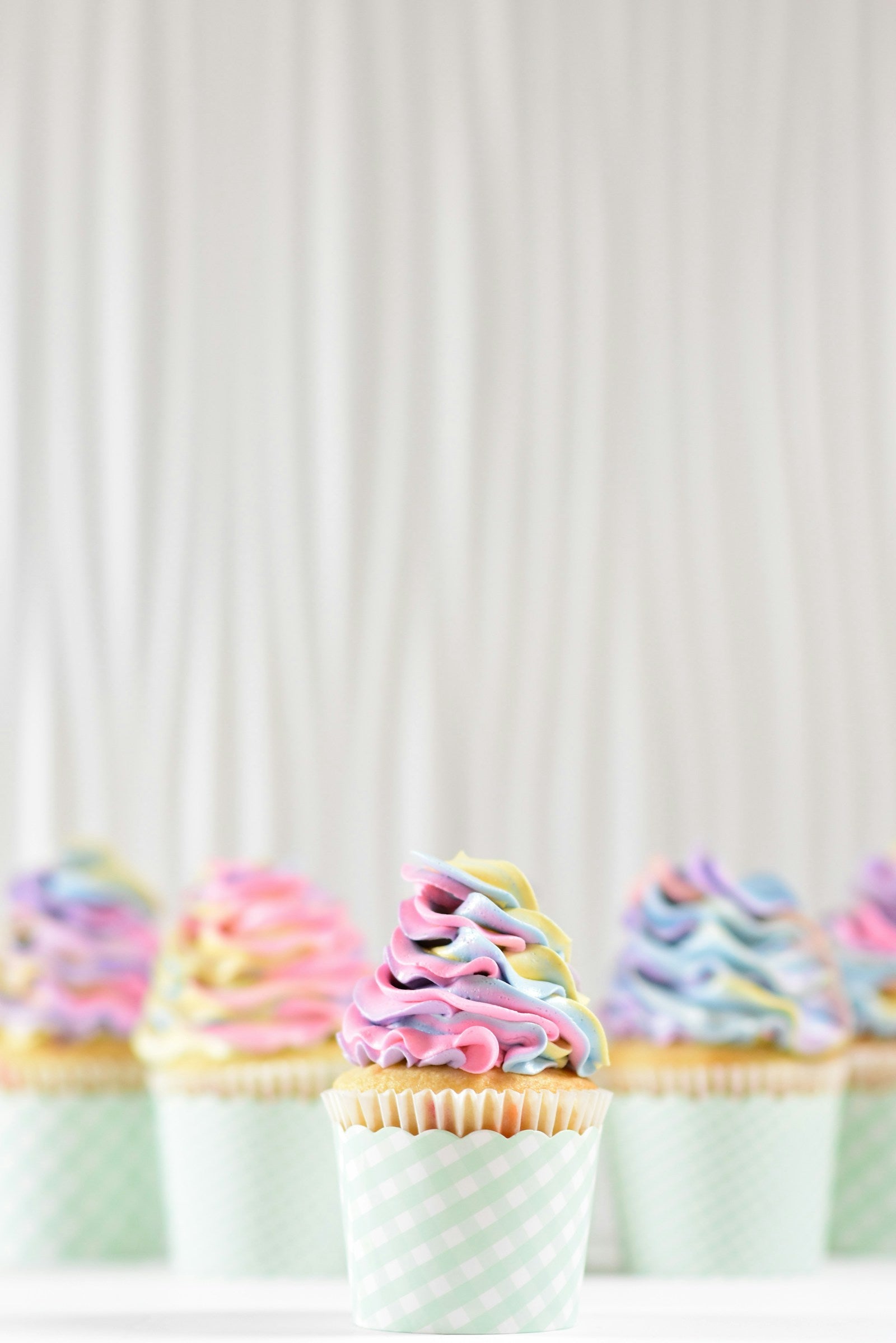 Close-up of cupcakes with swirled buttercream frosting